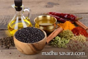 Fresh ingredients for Teliya Maah Kangri Dham recipe including black urad dal, mustard oil, desi ghee and whole spices - madhu savara.com