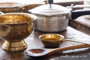 Traditional brass baltoi and cooking utensils for authentic Kangra Dham Teliya Maah recipe - madhu savara.com