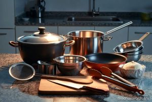 Essential kitchen utensils and cookware required for cooking Bombay Biryani including biryani pot, stockpot, frying pan, and tools