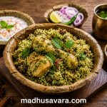 Authentic Karnataka Donne Chicken Biryani served in a traditional areca leaf donne with onion raita, salan, sliced onions, lemon wedges and fresh herbs.