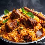 Authentic Kalyani Mutton Biryani in a metal bowl, featuring tender mutton pieces, saffron rice, and aromatic spices - steaming hot and vibrant