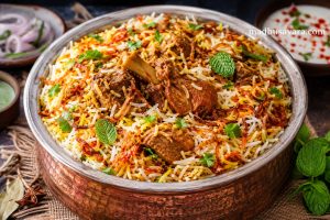 Authentic Lucknowi Biryani Recipe served in a traditional copper handi with saffron-infused basmati rice, tender dum-cooked mutton, crispy fried onions, fresh mint, and aromatic Awadhi spices.