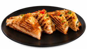Authentic Paneer Cheese Corn Sandwich grilled to golden perfection, stuffed with soft paneer, sweet corn, cheese, colourful vegetables and flavourful sauces, served as a popular Indian street food sandwich.