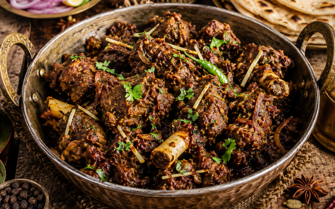 Traditional Ranjha Gosht served in a rustic brass handi, featuring slow-cooked dry mutton coated in rich Punjabi spices with tandoori roti, onions and whole spices.